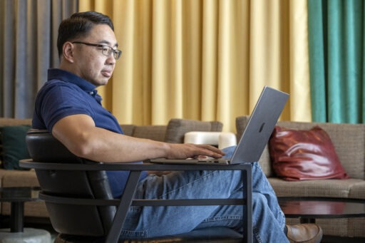 A man working on his laptop computer