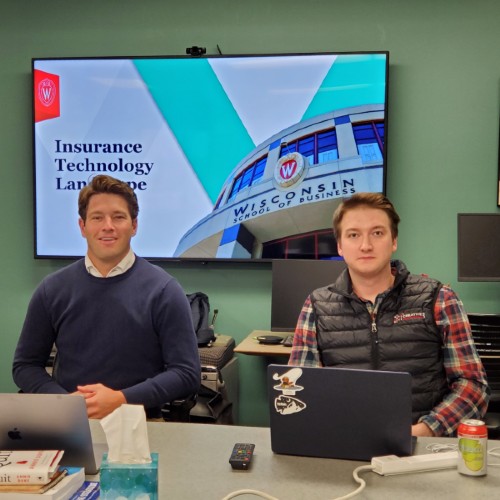 Fritz and Hayden in front of their opening slide that indicates Insurance Technology Landscape