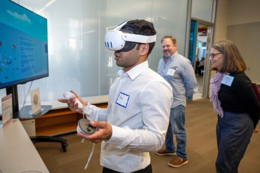 Akik Aziz shows his project to Michelle Somes-Booher during the Technology Exploration Lab open house